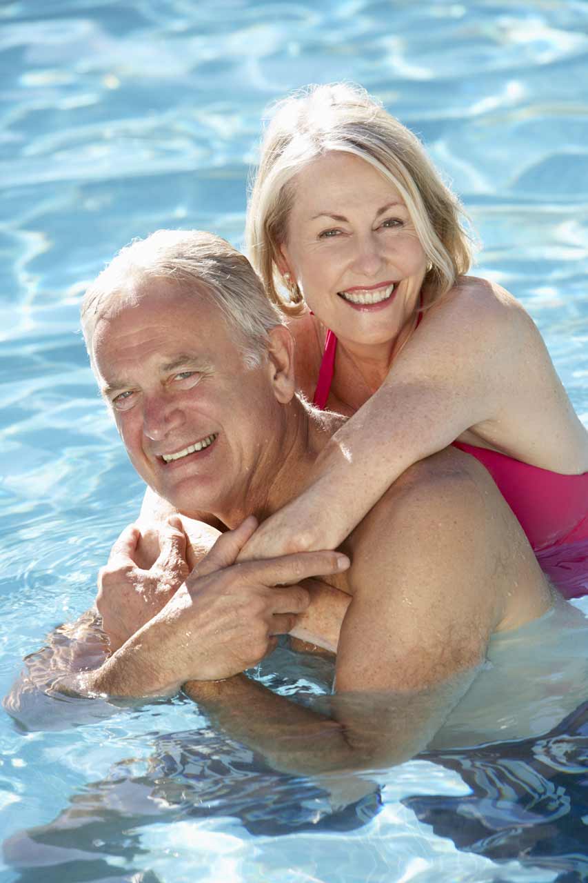 A couple enjoying a swimming pool